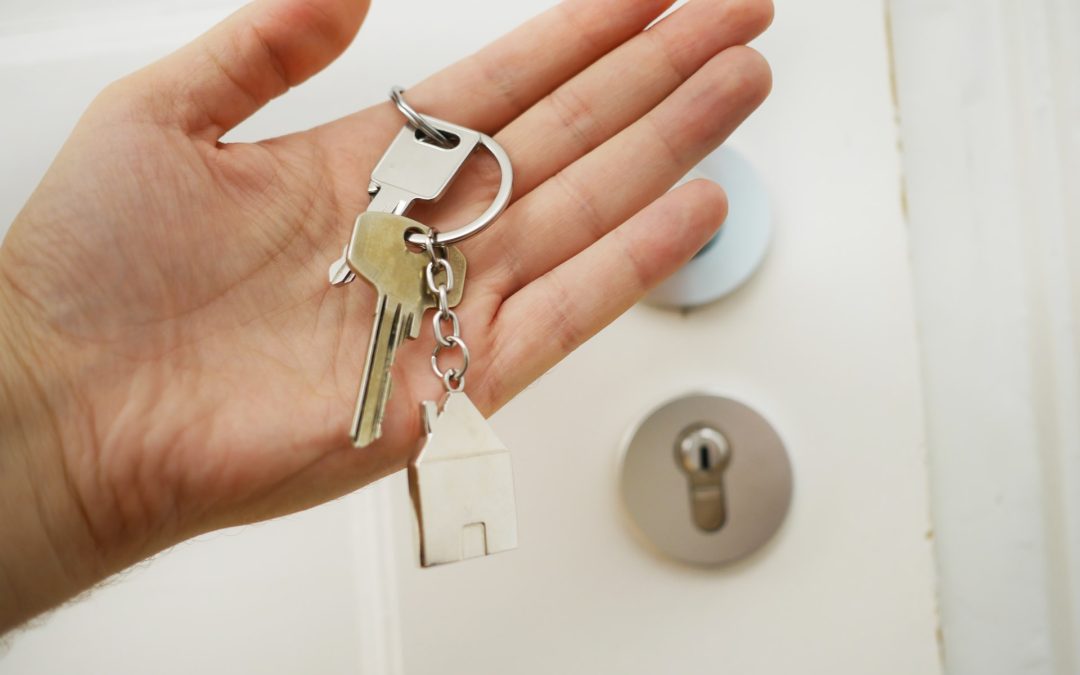 A house key in a hand
